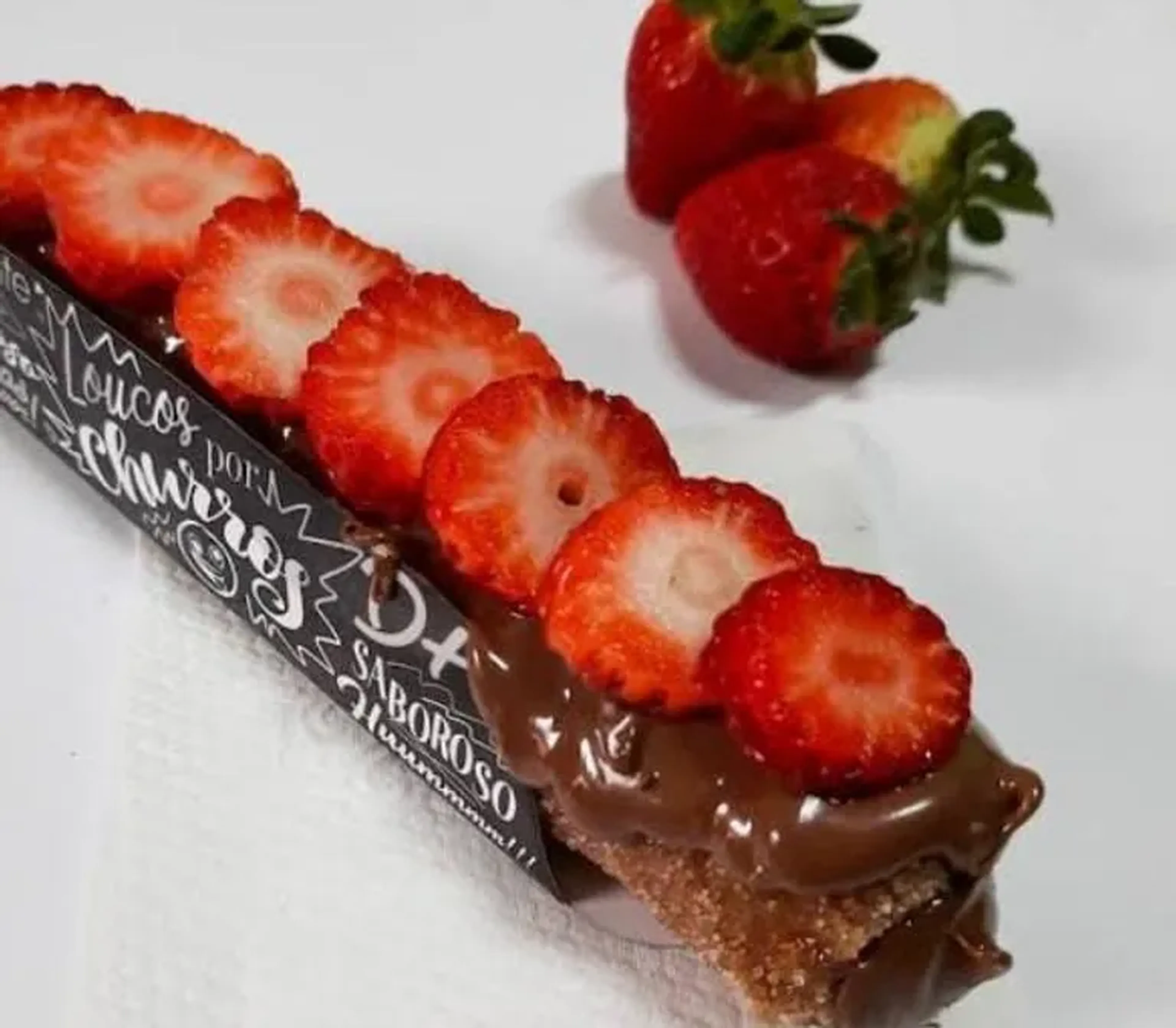 churros chocolate com morango imagem