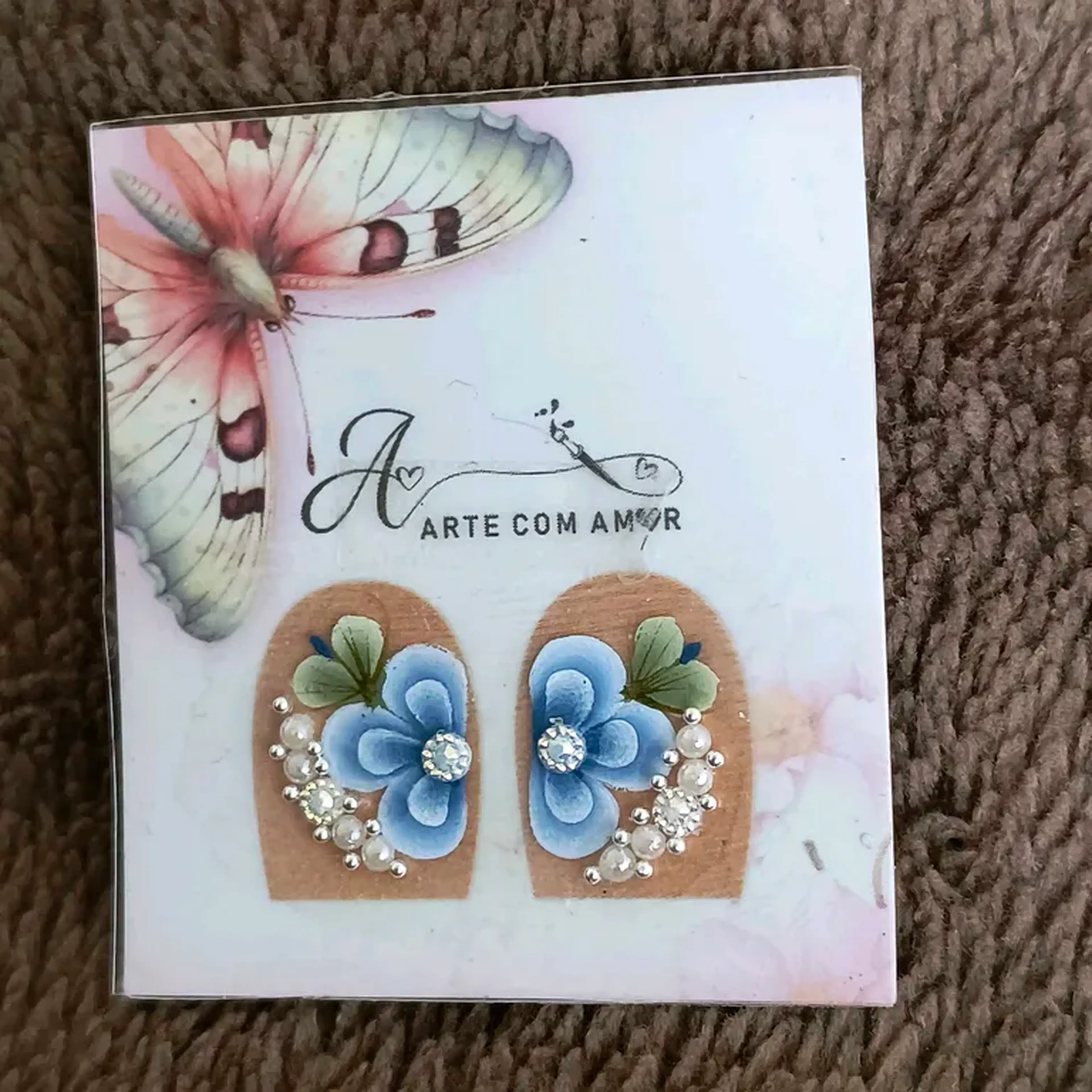 Filha única flor azul com pedrarias imagem