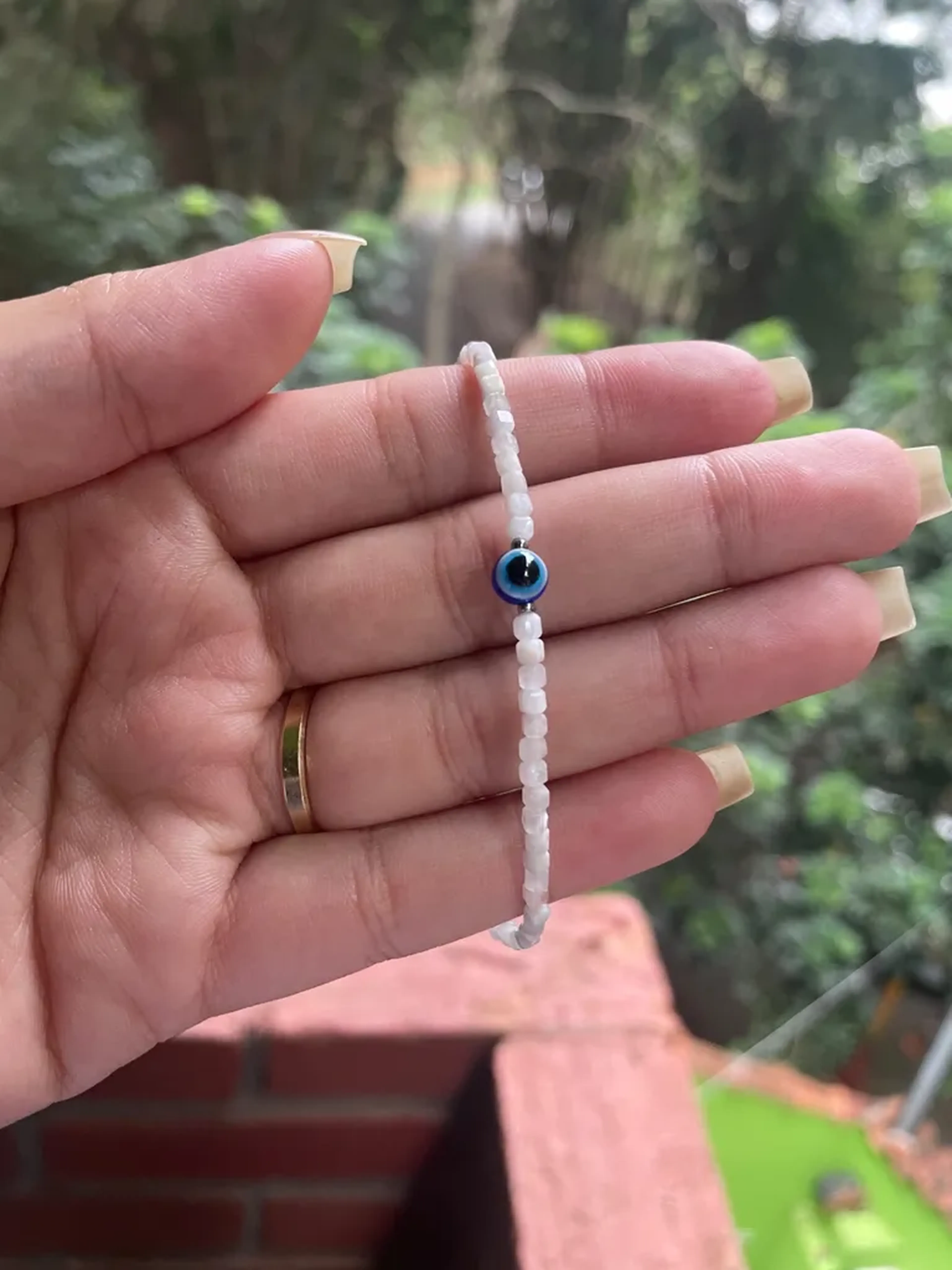 Pulseira Selenita 2mm com olho grego imagem