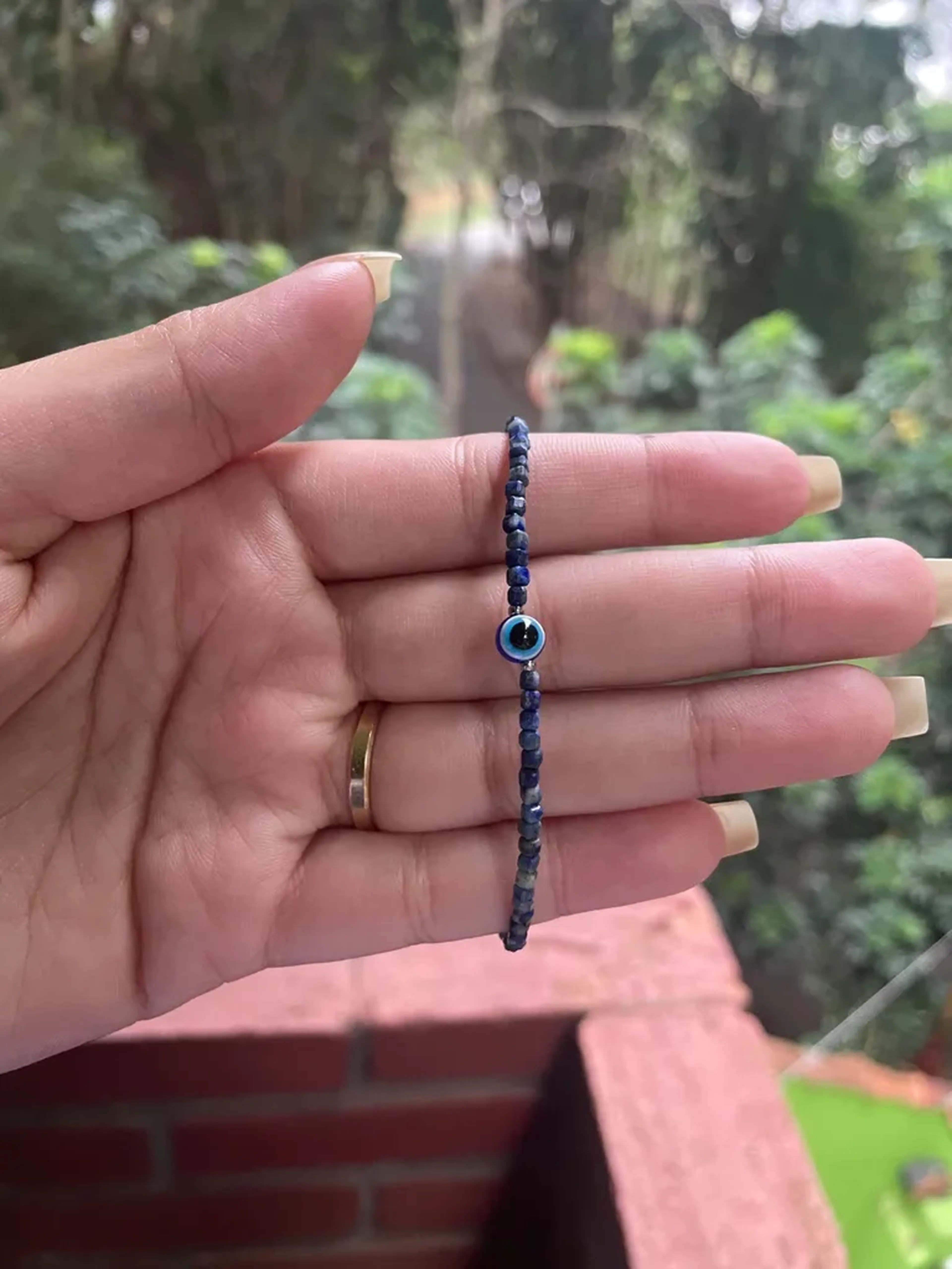 Pulseira Lápis Lazuli 2mm com olho grego imagem